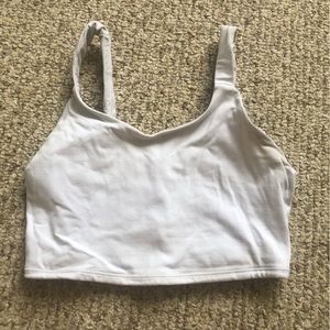 Cropped white sports bra tank
